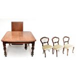 A 19th century mahogany pullout extending dining table, with one extra leaf, raised on turned column