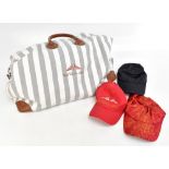 YACHT CLUB OF MONACO; a large grey and white striped canvas holdall trimmed in tan leather, with