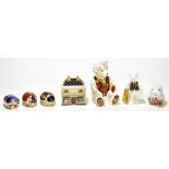ROYAL CROWN DERBY; a collection of seven paperweights comprising 'Govier's China Shop', limited