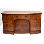 An early 19th century Scottish mahogany bow front sideboard, with central compartmented cutlery