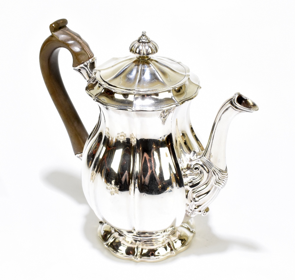 WILLIAM ELEY; a George IV hallmarked silver coffee pot of baluster form with cast finial and