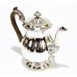 WILLIAM ELEY; a George IV hallmarked silver coffee pot of baluster form with cast finial and