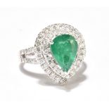 An 18ct white gold emerald and diamond ring, the pear shaped emerald weighing approx. 2.26ct