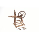 A 19th century German oak and fruitwood spinning wheel, with painted plaque inscribed 'Eftermauo',