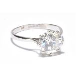 A platinum and diamond solitaire ring, the round brilliant cut stone weighing approx 2.1ct in