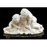 A large contemporary cream glazed figure group of two cherubs set on a gilt metal base, length