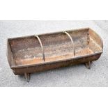 A cast iron animal feeding trough, width 92cm.Additional InformationHeavily weathered, corroded