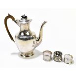 R HODD & SON; an Edward VII hallmarked silver coffee pot of plain oval form, London 1908, together