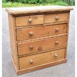 A Victorian pine chest of two short and three long drawers on plinth base, height 95cm, width