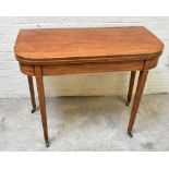 A George III inlaid mahogany foldover tea table, later converted to a games table, raised on