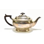 THOMAS BRADBURY & SONS; an Elizabeth II hallmarked silver teapot with Bakelite handle and finial,