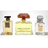 Three factice shop display perfume bottles comprising Mariella Burani with floral stopper, height