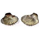 A pair of Edwardian hallmarked silver shell dishes with ribbed veins terminating with pierced