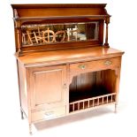 An Edwardian walnut mirror back sideboard, the top with a single shelf supported on columns,