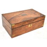 A Victorian walnut writing slope, the lid with blank cartouche,