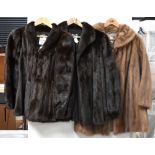 Three vintage mink jackets comprising a black ranch mink jacket with roll collar,