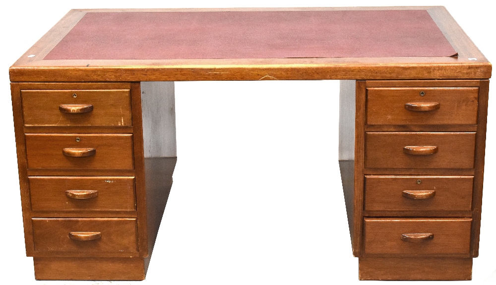 An early 20th century oak eight-drawer twin pedestal desk,