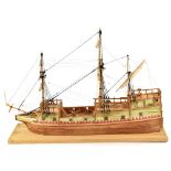A wooden scratch-built model of a three-masted galleon in the 18th century style, with model cannon,