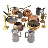 A quantity of mixed metalware to include various copper jelly moulds, watering can,