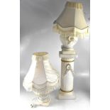 A bisque plaster-effect white baluster table lamp with decorative gilt swag,
