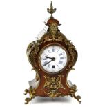 A late 19th century walnut and gilt metal mounted mantel clock,