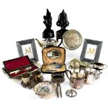 A collection of silver plate to include scalloped shell dish on three ball feet,