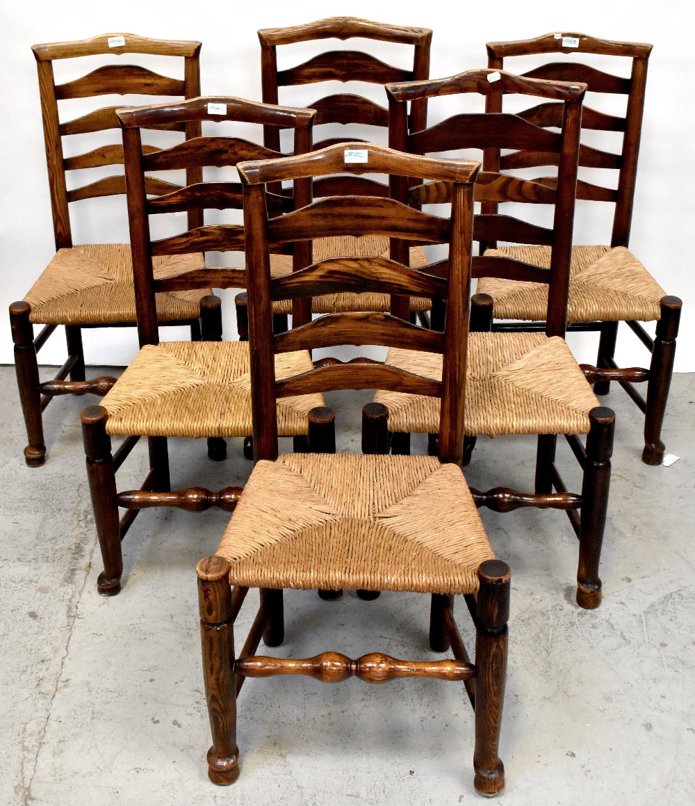 A set of six 18th century ladder back rush seated chairs with four rails,