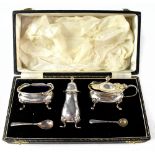 An Elizabeth II hallmarked silver cased three-piece cruet, Birmingham 1952, maker's mark rubbed,