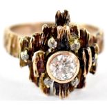 A yellow metal bark-effect and diamond solitaire ring,