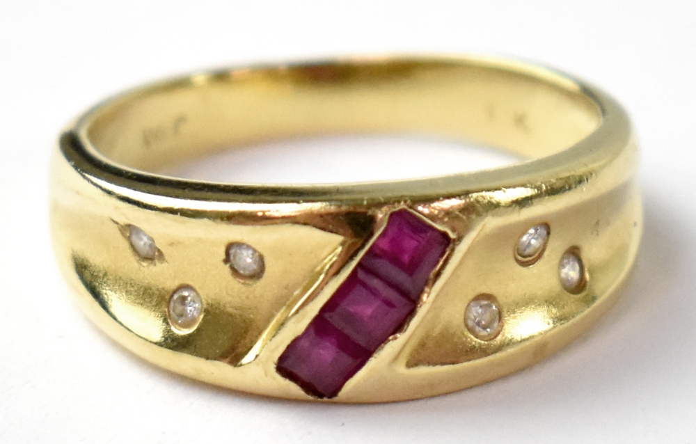 A modern 14ct gold ring, set with a line of three square rubies and six small diamonds, size P,