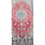 A fine Persian handmade Qum rug, 203 x 118cm.