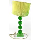 A retro-style table lamp, green Perspex column to square base with pleated silk-effect shade,