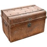 A late 19th century metal travel trunk with studded top and carrying handles containing a quantity