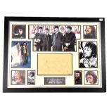 JOHN LENNON; a framed montage of nine photographs of The Beatles star,