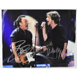 A signed Bruce Springsteen and Mick Jagger in concert photograph, 28 x 36cm.