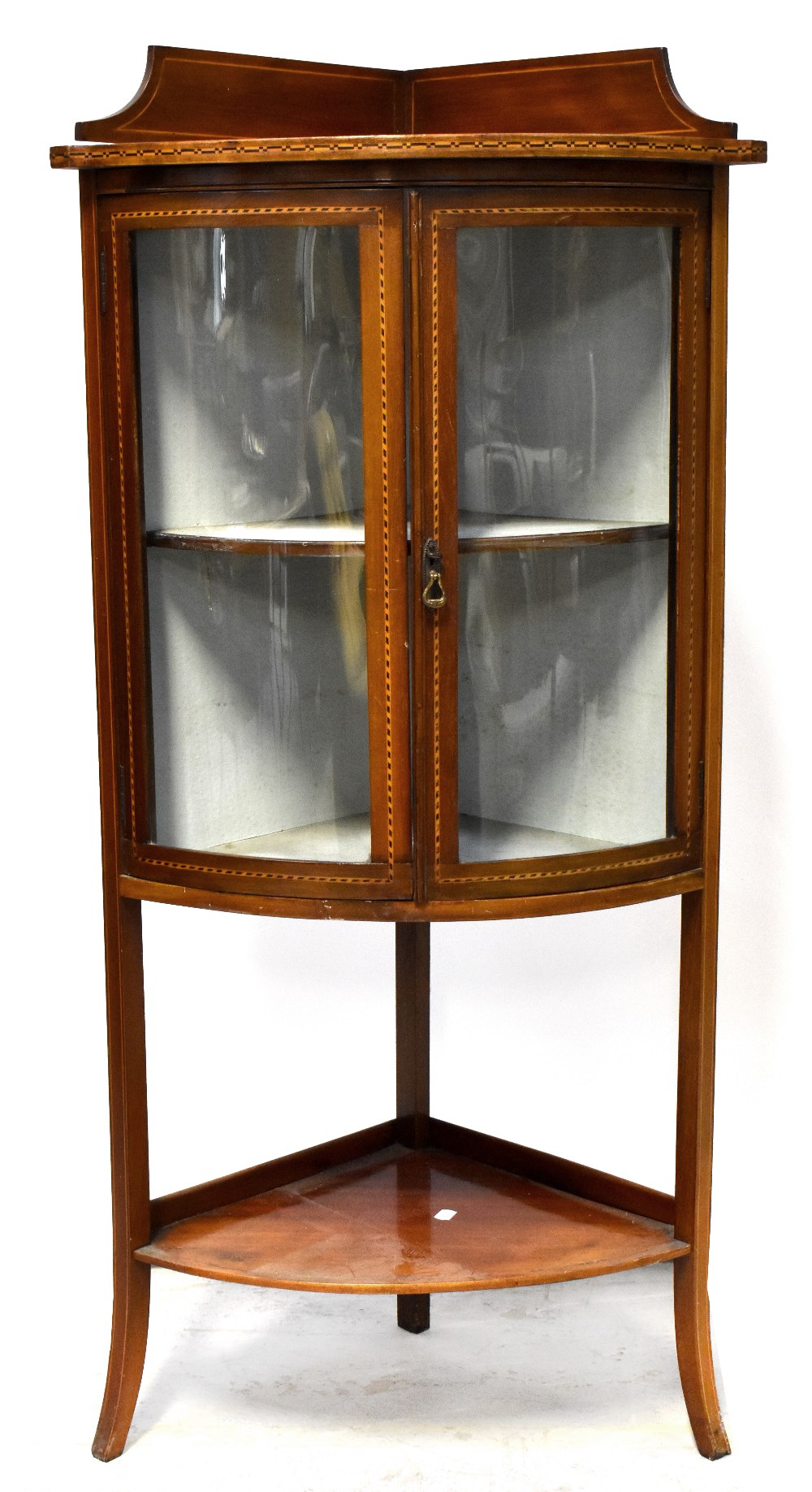 An Edwardian inlaid walnut two-door corner display cabinet,