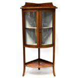 An Edwardian inlaid walnut two-door corner display cabinet,