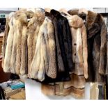 Five vintage c1950s and 1960s fur coats and jackets to include a honey possum and raccoon jacket,