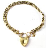 A vintage 9ct gold gate bracelet with heart shaped clasp, length 18cm, approx 8.2g.