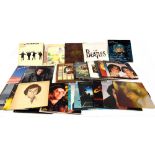 Approximately two hundred LPs including three Beatles albums, eleven Elton John albums,
