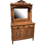 An early 20th century oak Arts and Crafts style dresser,