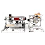 Two kit-built CNC engravers/routers with rotating head, moveable table, aluminium frame,