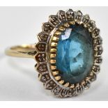A 9ct gold dress ring set with central blue stone, stamped 375, approx 4.5g.