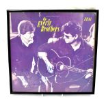 THE EVERLY BROTHERS; LP and sleeve signed by both brothers, framed and Perspex glazed,