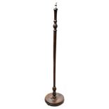An early 20th century mahogany standard lamp,