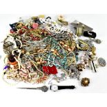 A large collection of assorted costume jewellery to include ladies' wrist watches,