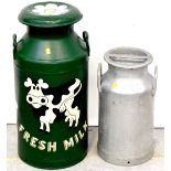 Two vintage milk churns, the largest painted green and decorated with white daisy flower heads,