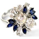 A good white metal diamond and sapphire floral ring,