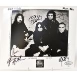 BLACK SABBATH; a black and white photograph bearing the four signatures of Ozzy Osbourne,