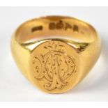 An 18ct yellow gold signet ring, initialled to to the top, size O, approx 7.9g.